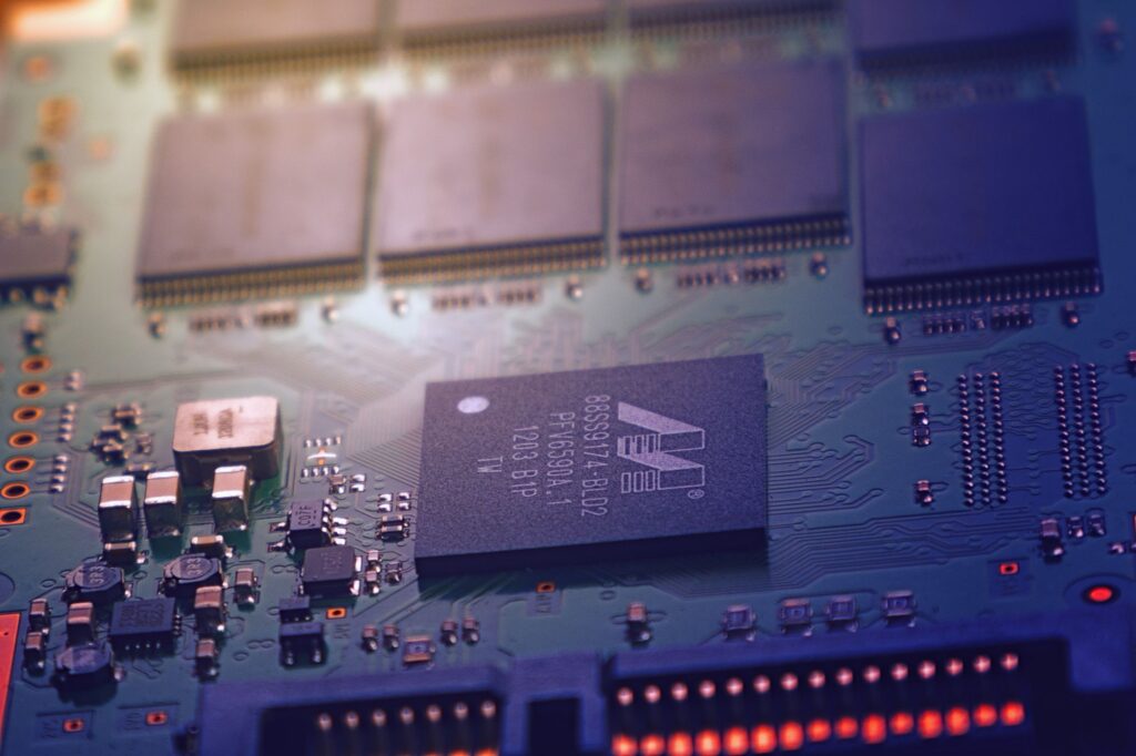 Green circuit board with microchips and wiring