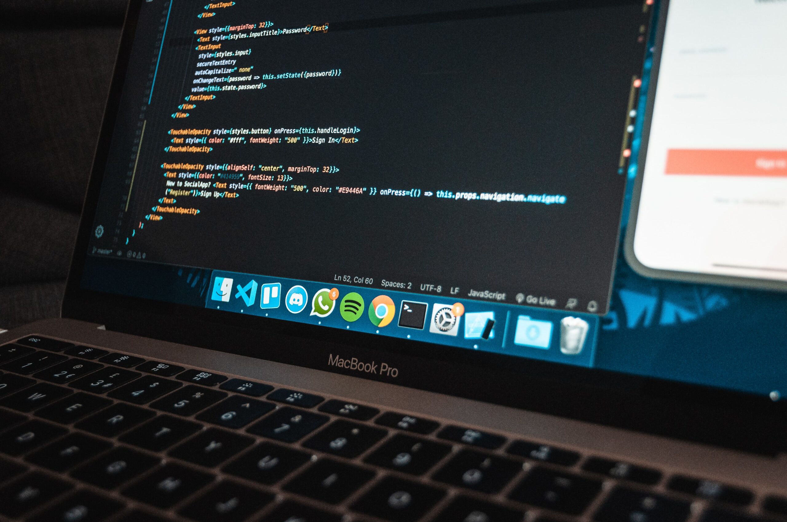 Modern workplace with programming on laptop
