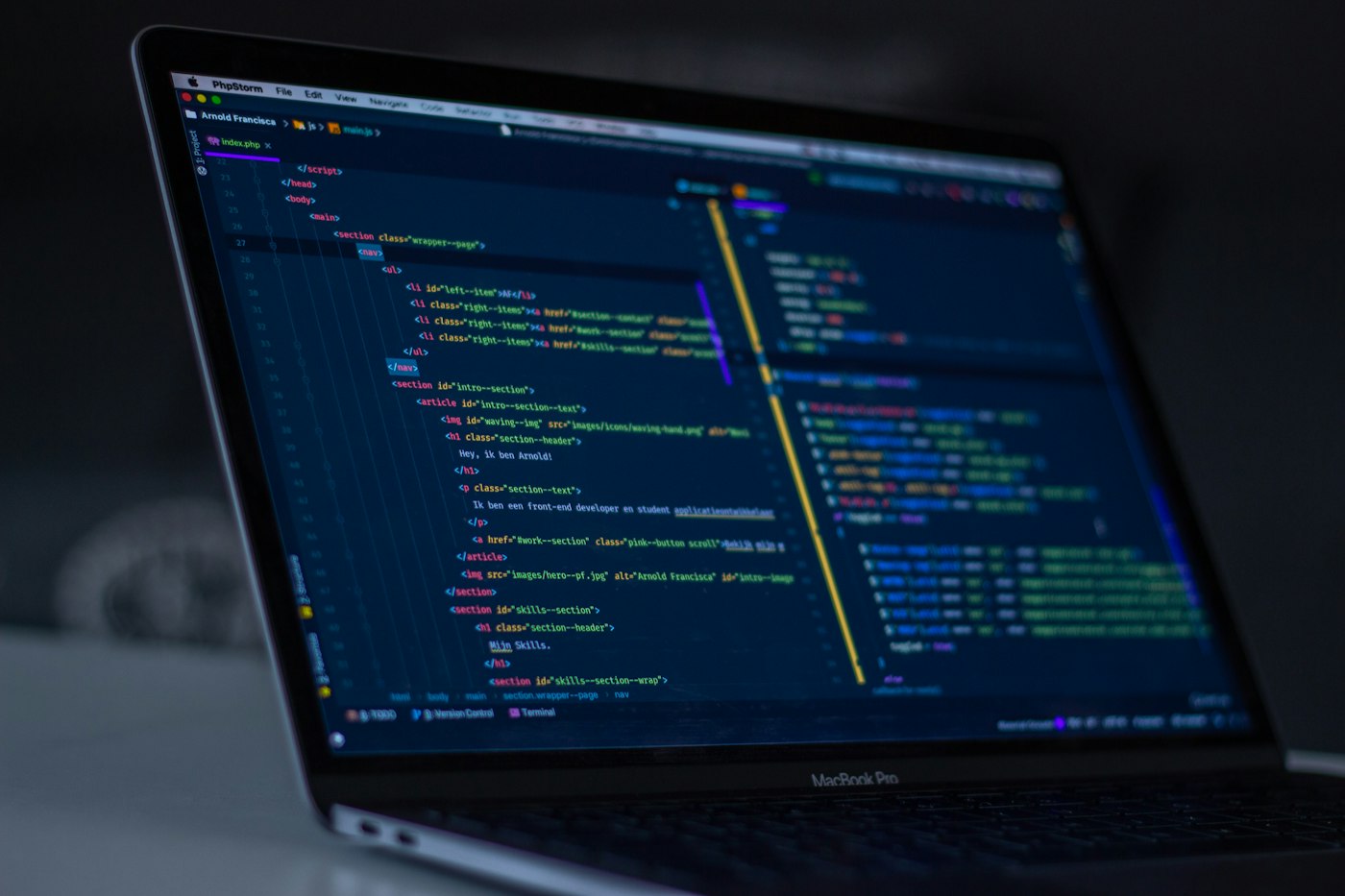 Software engineering workspace with code on screen